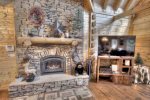 Large stone gas fire place in main living area